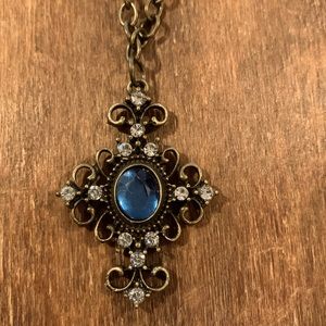 Vintage style cross with long brass chain.